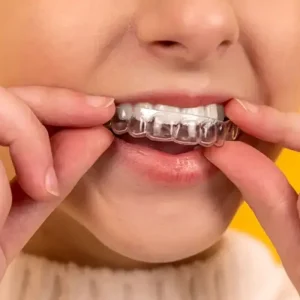 Patient wearing a dental retainer